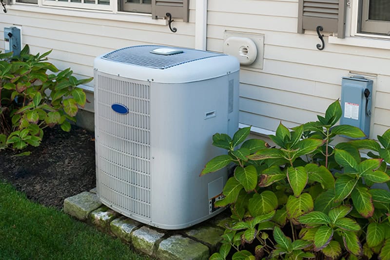 Carrier air conditioning unit outside a home.